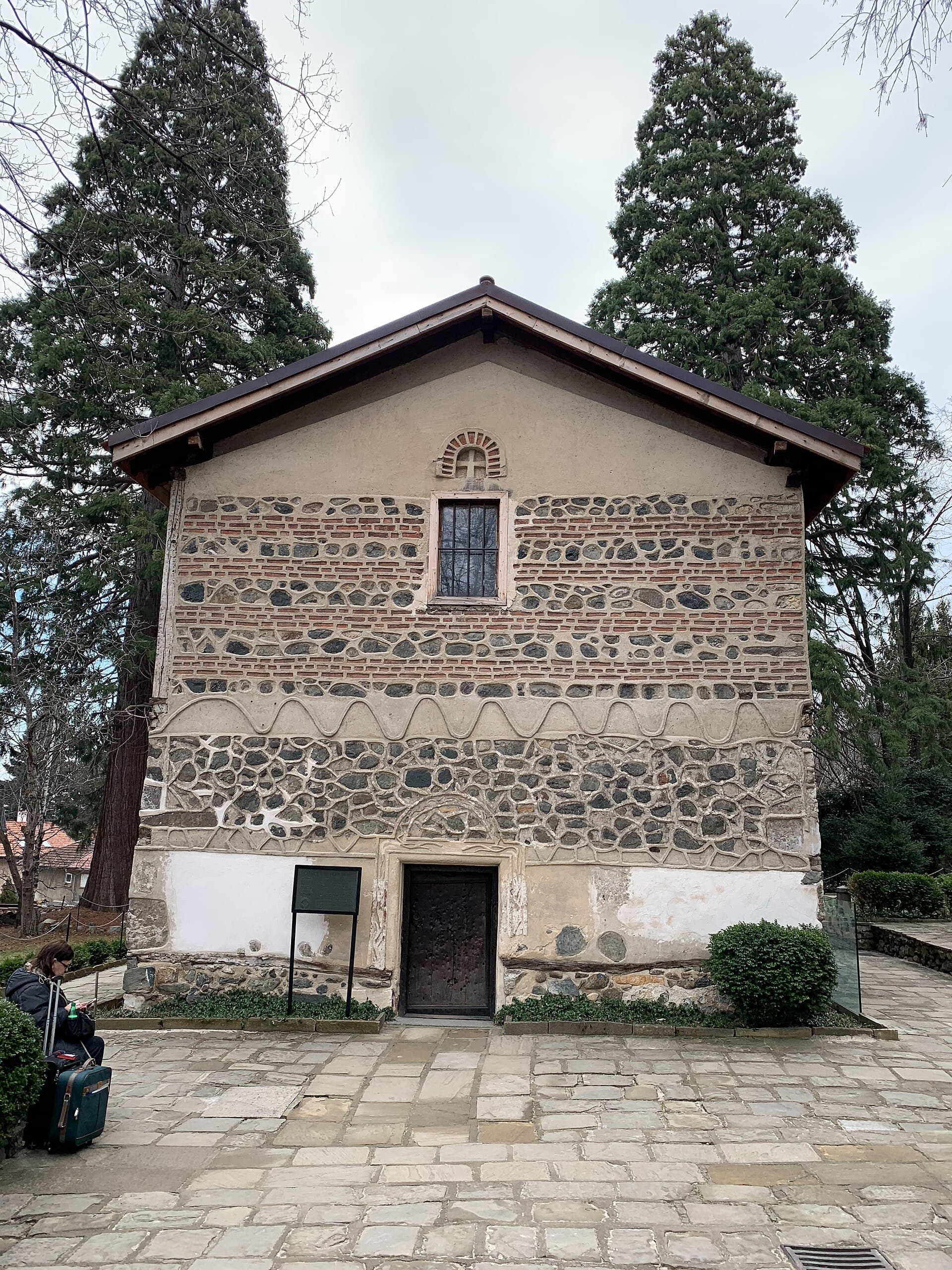 Boyana Church's stone and brick exterior, with its distinctive medieval patterned facade