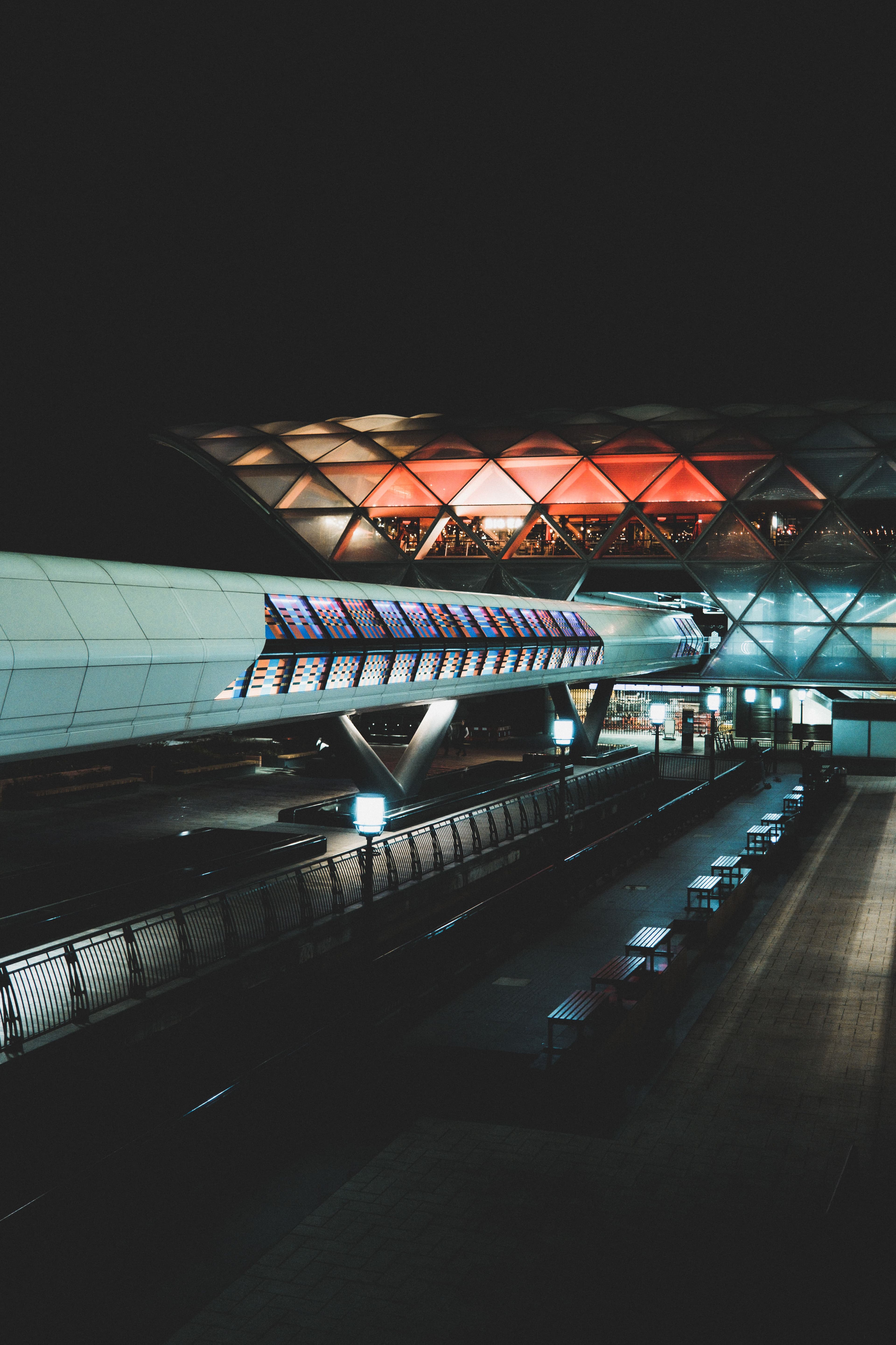 An airport terminal illuminated at night