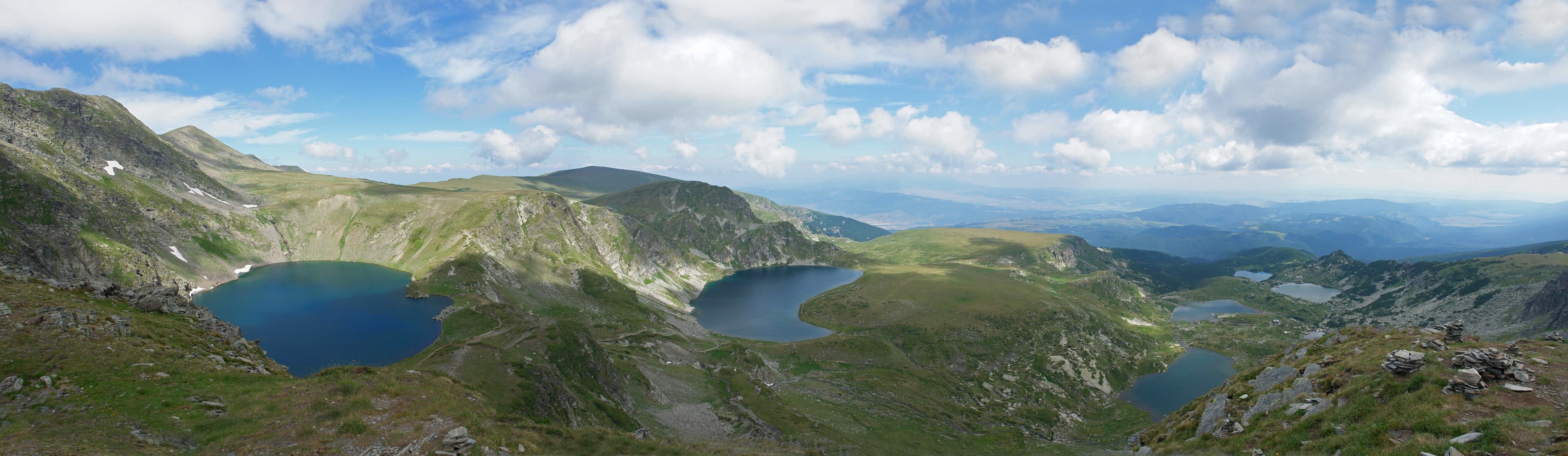 A panoramic view over the glacial cirque holding the Seven Rila Lakes in Bulgaria's Rila Mountains